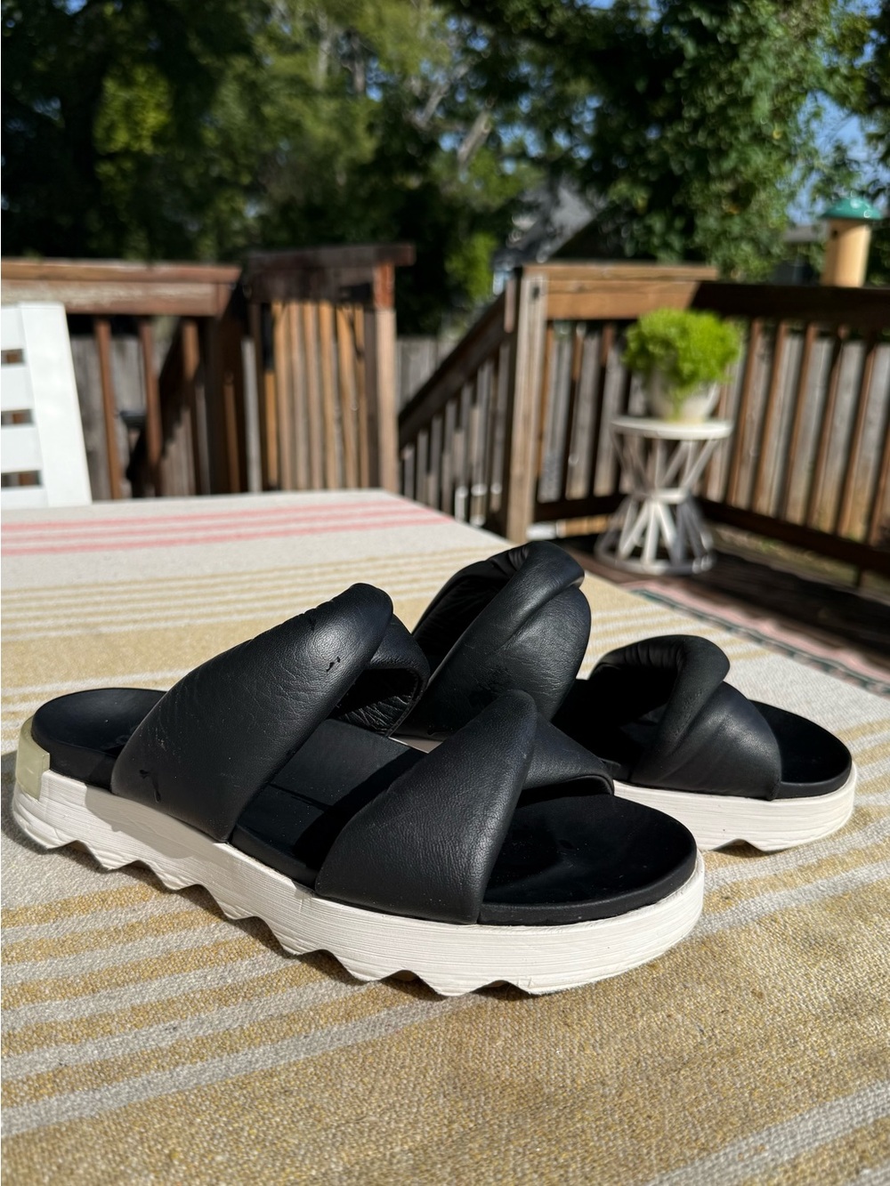Sorel Black Slide Sandals with White Platform Sole